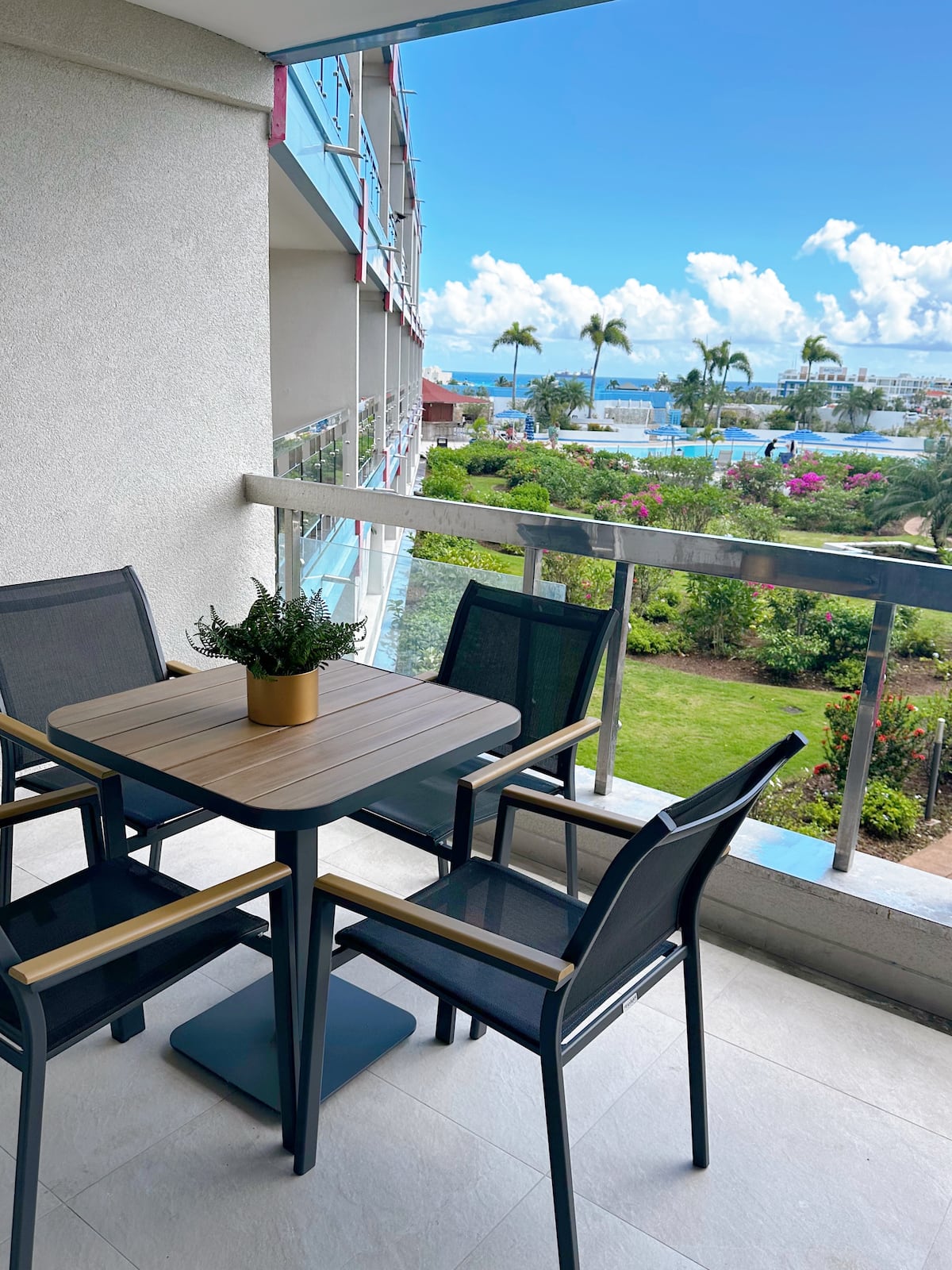 One Love Maho balcony view with pool and ocean in Maho Beach, Sint Maarten